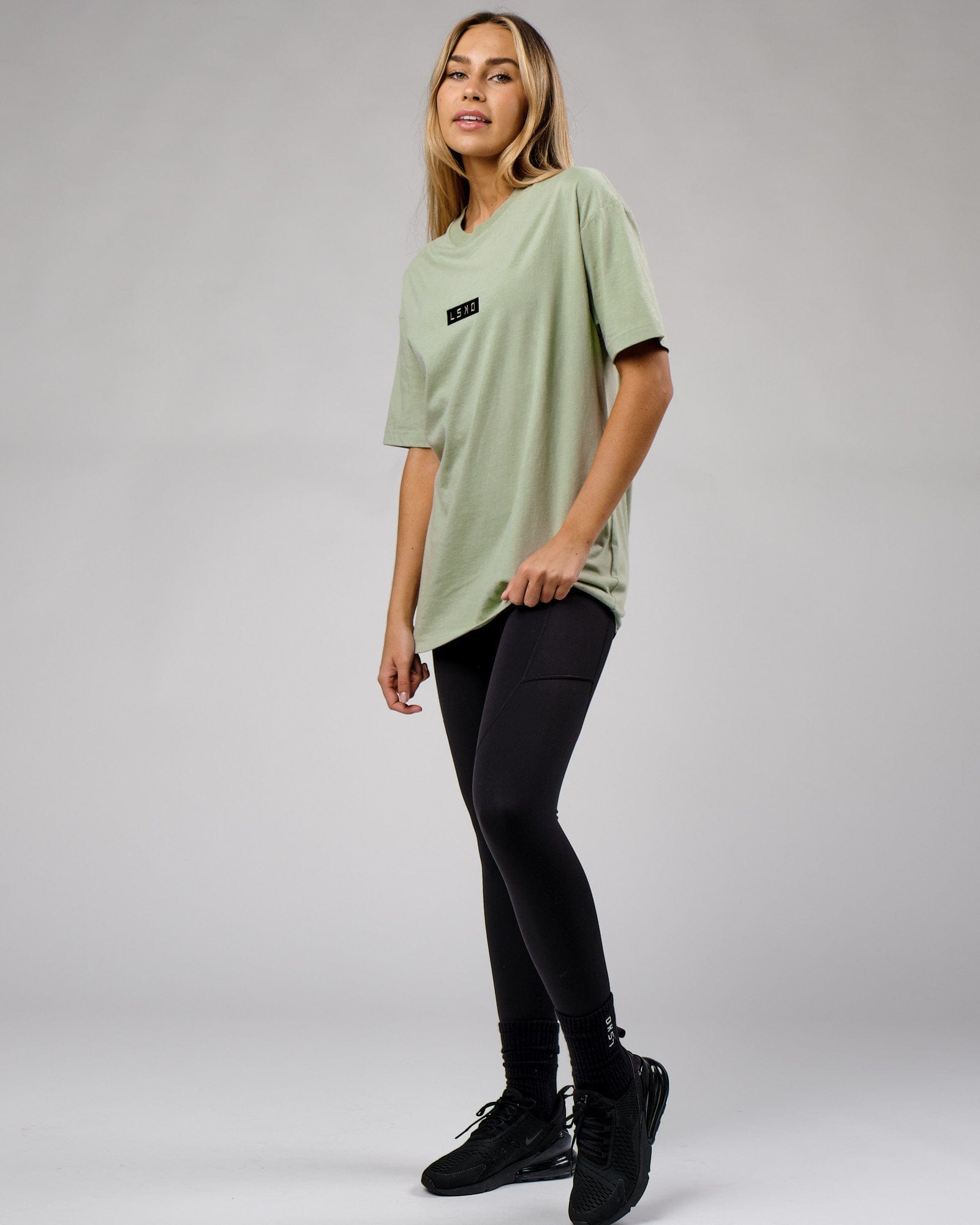 Model wearing Unisex Cornerstone Tee Oversize - Desert Sage