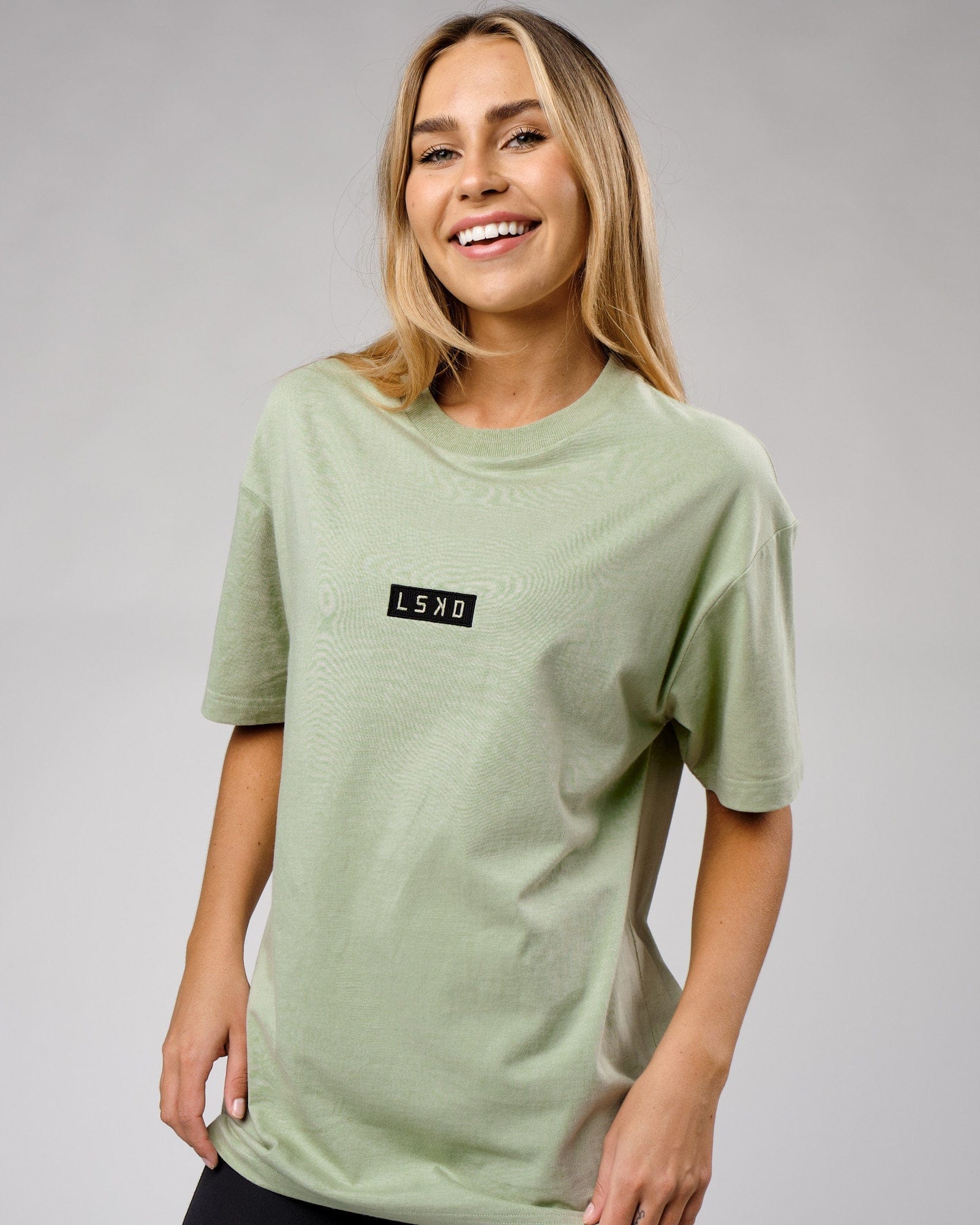 Model wearing Unisex Cornerstone Tee Oversize - Desert Sage