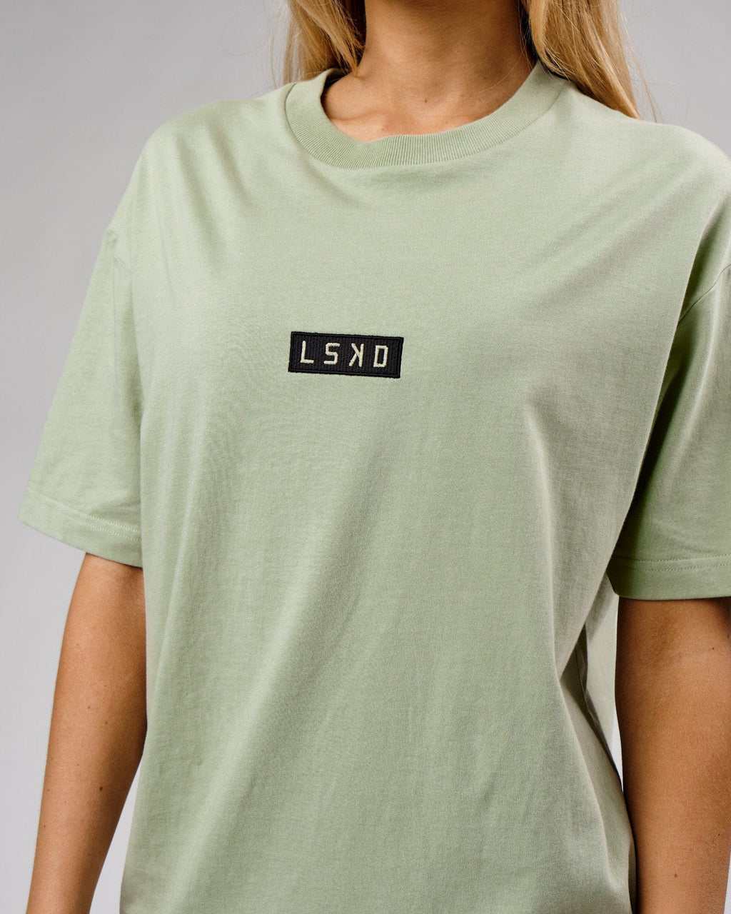 Model wearing Unisex Cornerstone Tee Oversize - Desert Sage