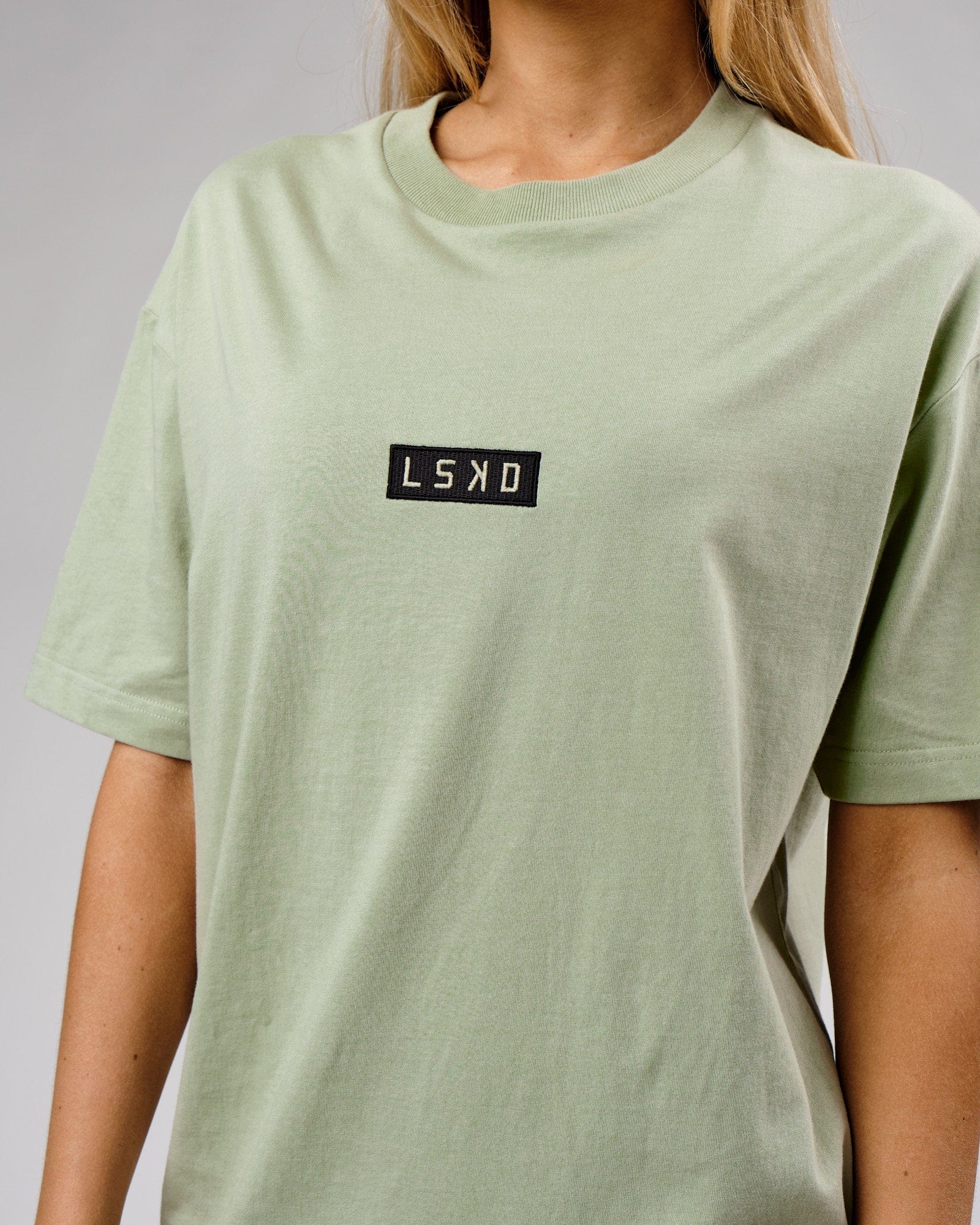 Model wearing Unisex Cornerstone Tee Oversize - Desert Sage