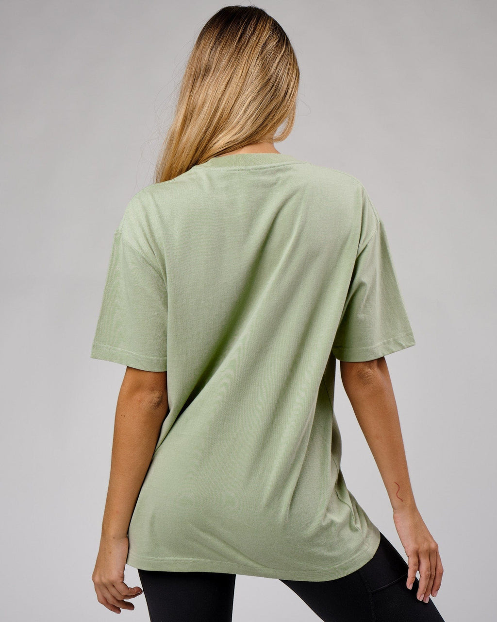 Model wearing Unisex Cornerstone Tee Oversize - Desert Sage