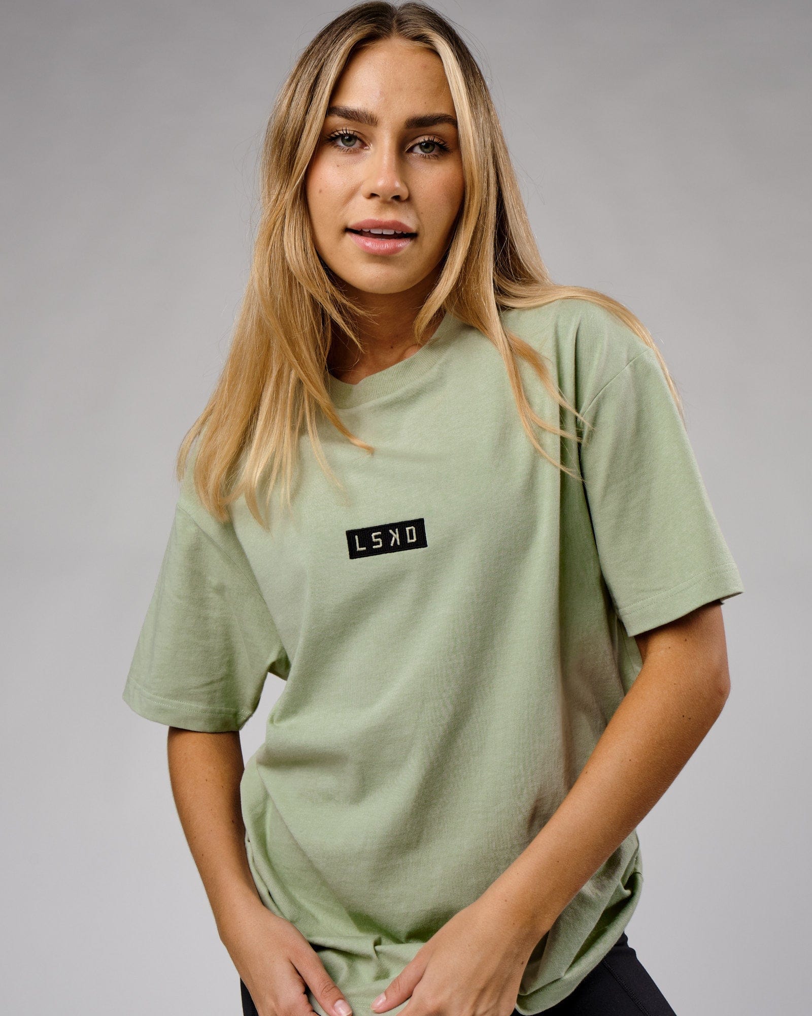 Model wearing Unisex Cornerstone Tee Oversize - Desert Sage