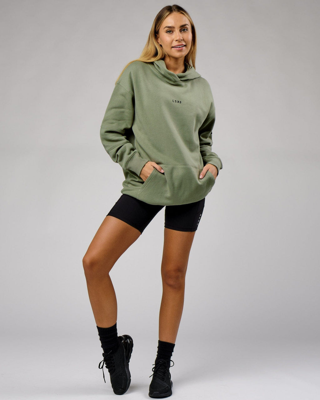 Model wearing Unisex Upfield Hoodie Oversize - Sea Spray