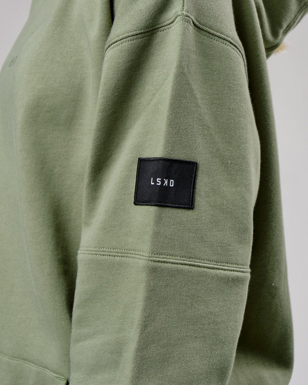 Model wearing Unisex Upfield Hoodie Oversize - Sea Spray