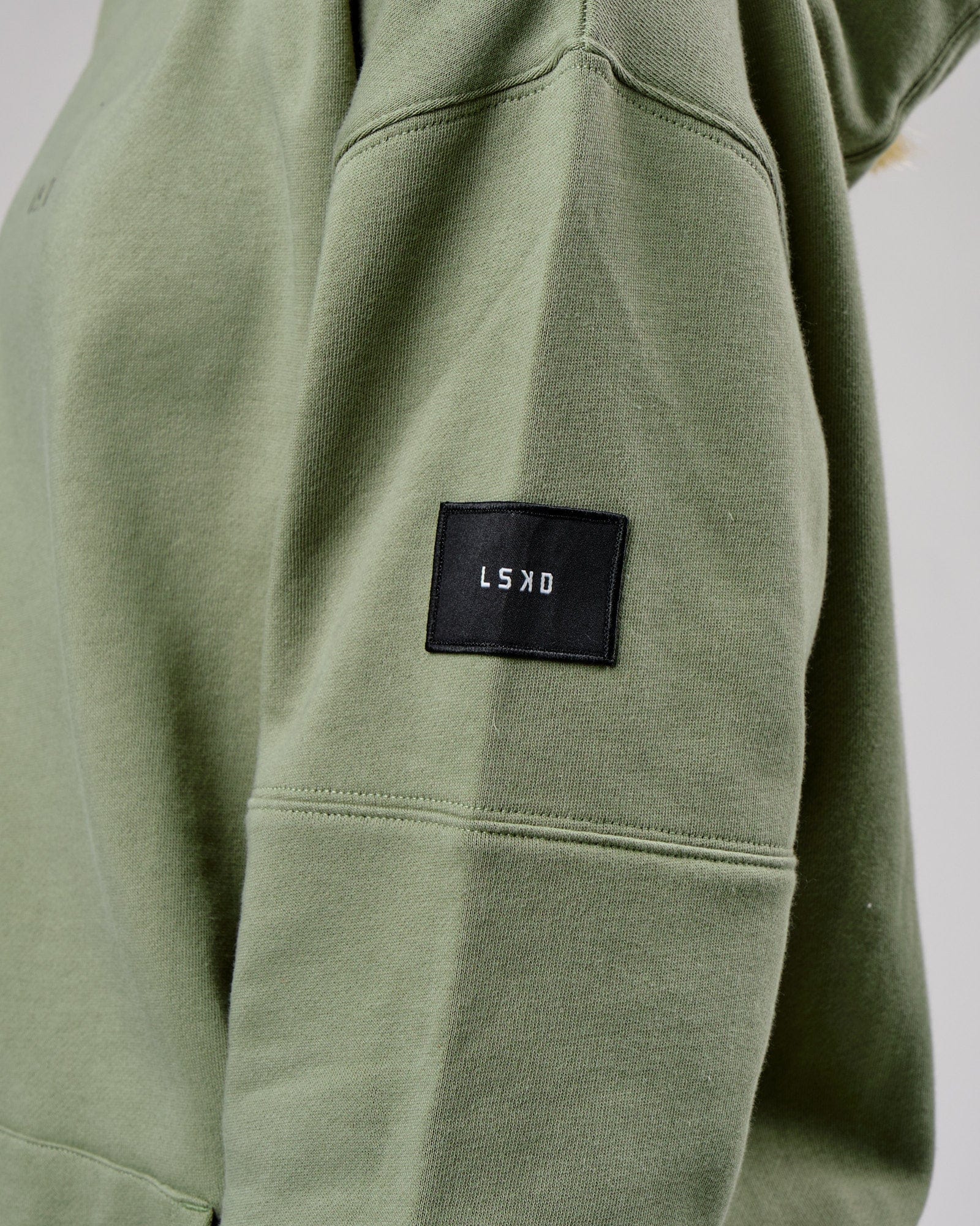 Model wearing Unisex Upfield Hoodie Oversize - Sea Spray