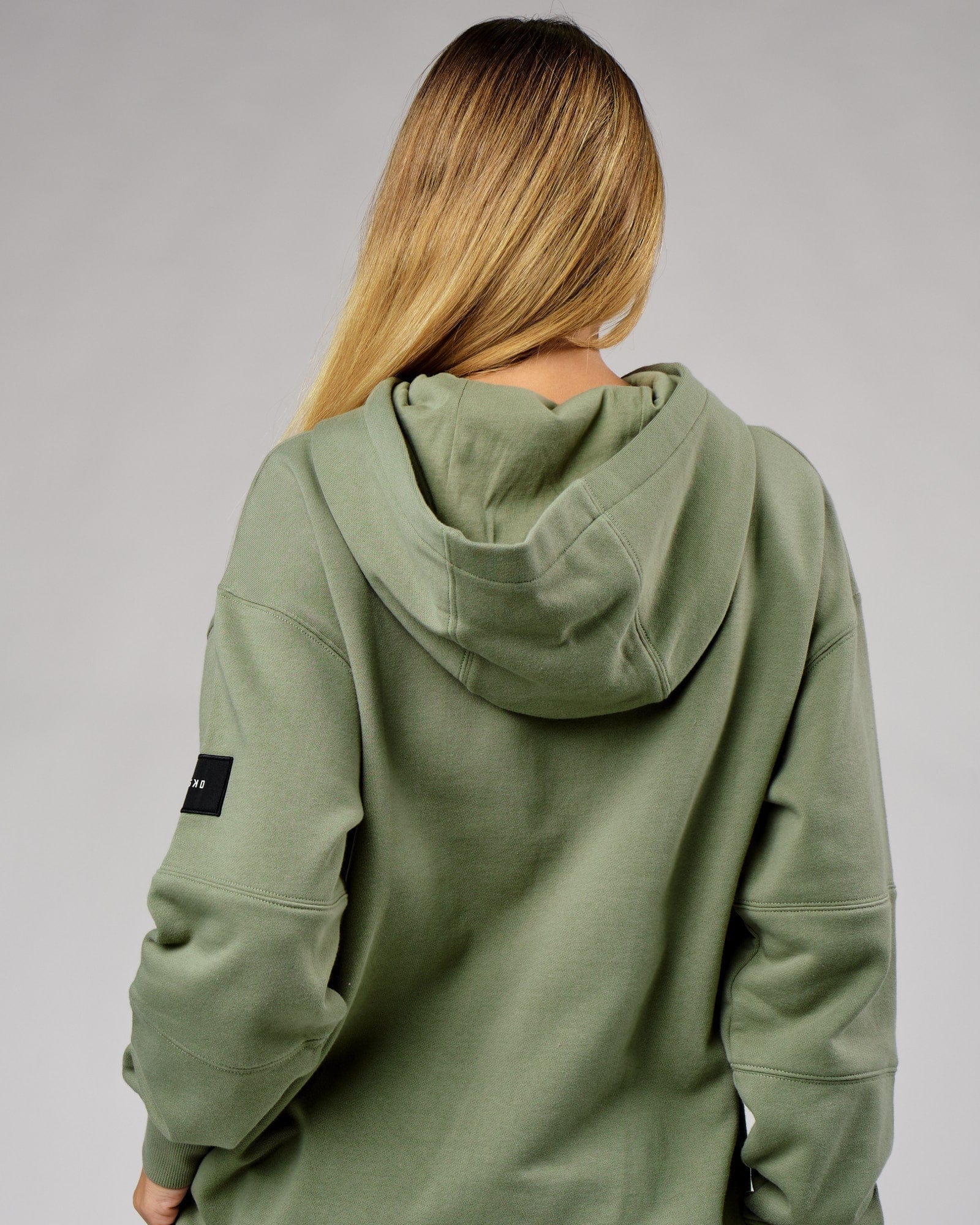 Model wearing Unisex Upfield Hoodie Oversize - Sea Spray