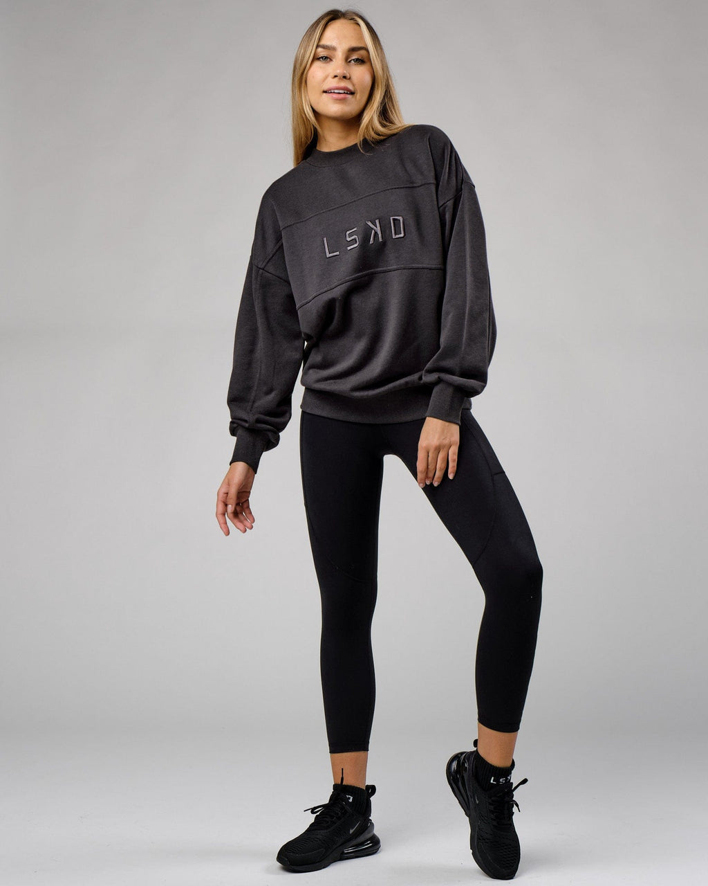 Model wearing Unisex Slice Sweater Oversize - Phantom