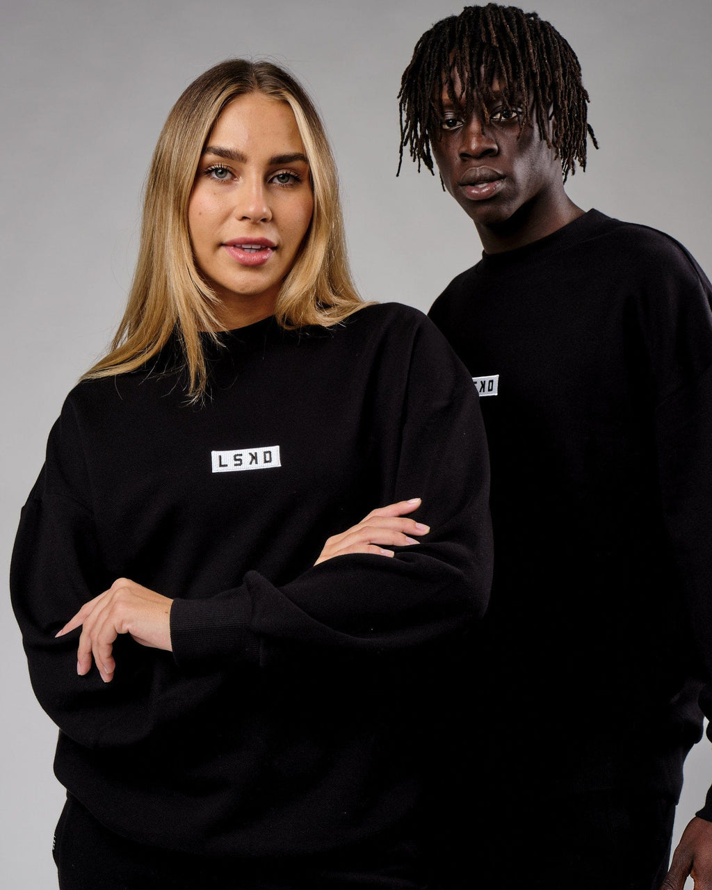 Model wearing Unisex Cornerstone Sweater Oversize - Black