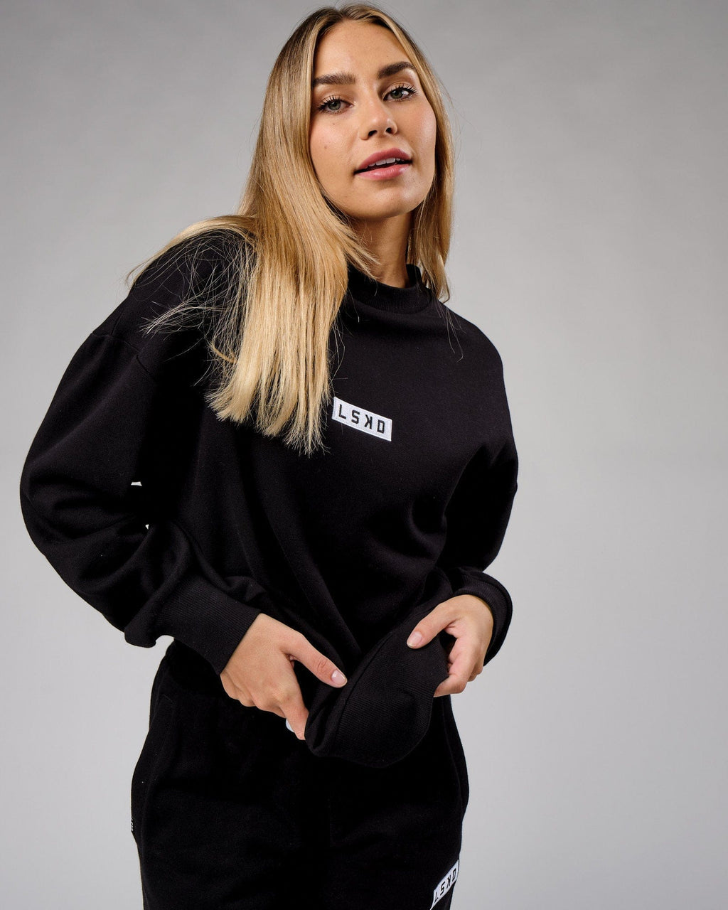 Model wearing Unisex Cornerstone Sweater Oversize - Black