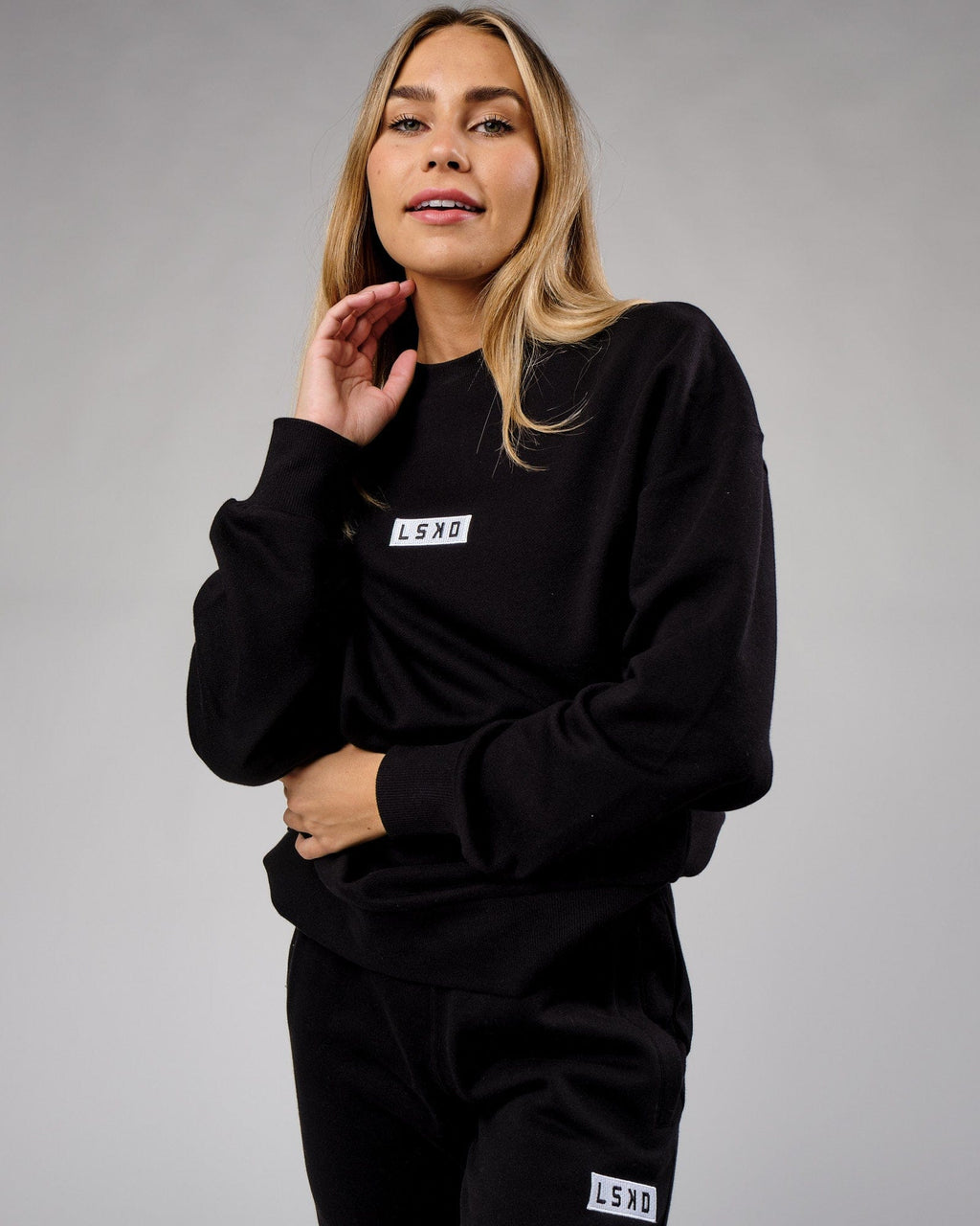 Model wearing Unisex Cornerstone Sweater Oversize - Black
