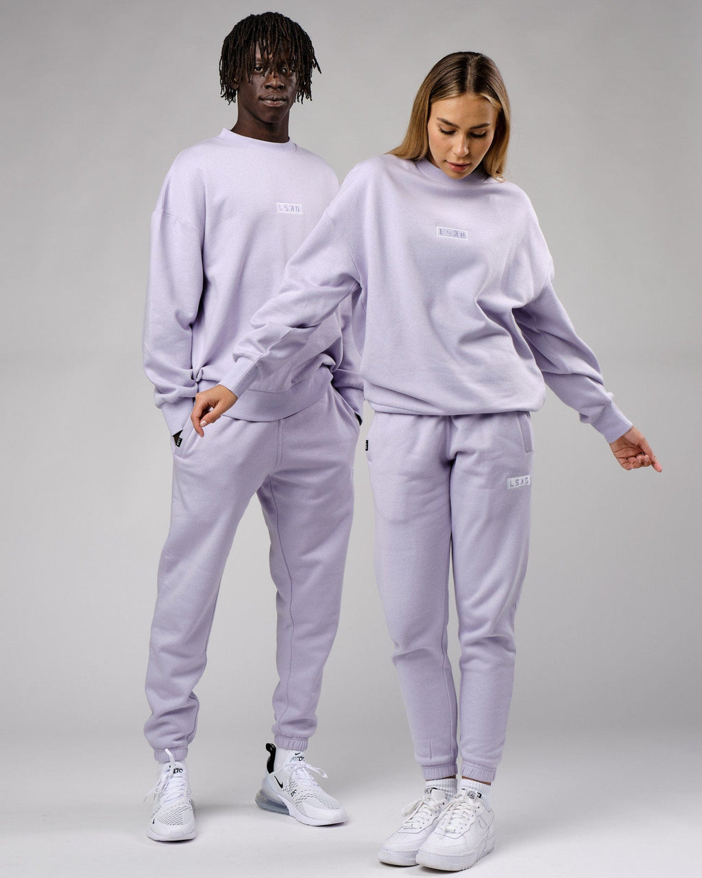 Model wearing Unisex Cornerstone Track Pant Oversize - Cosmic Sky