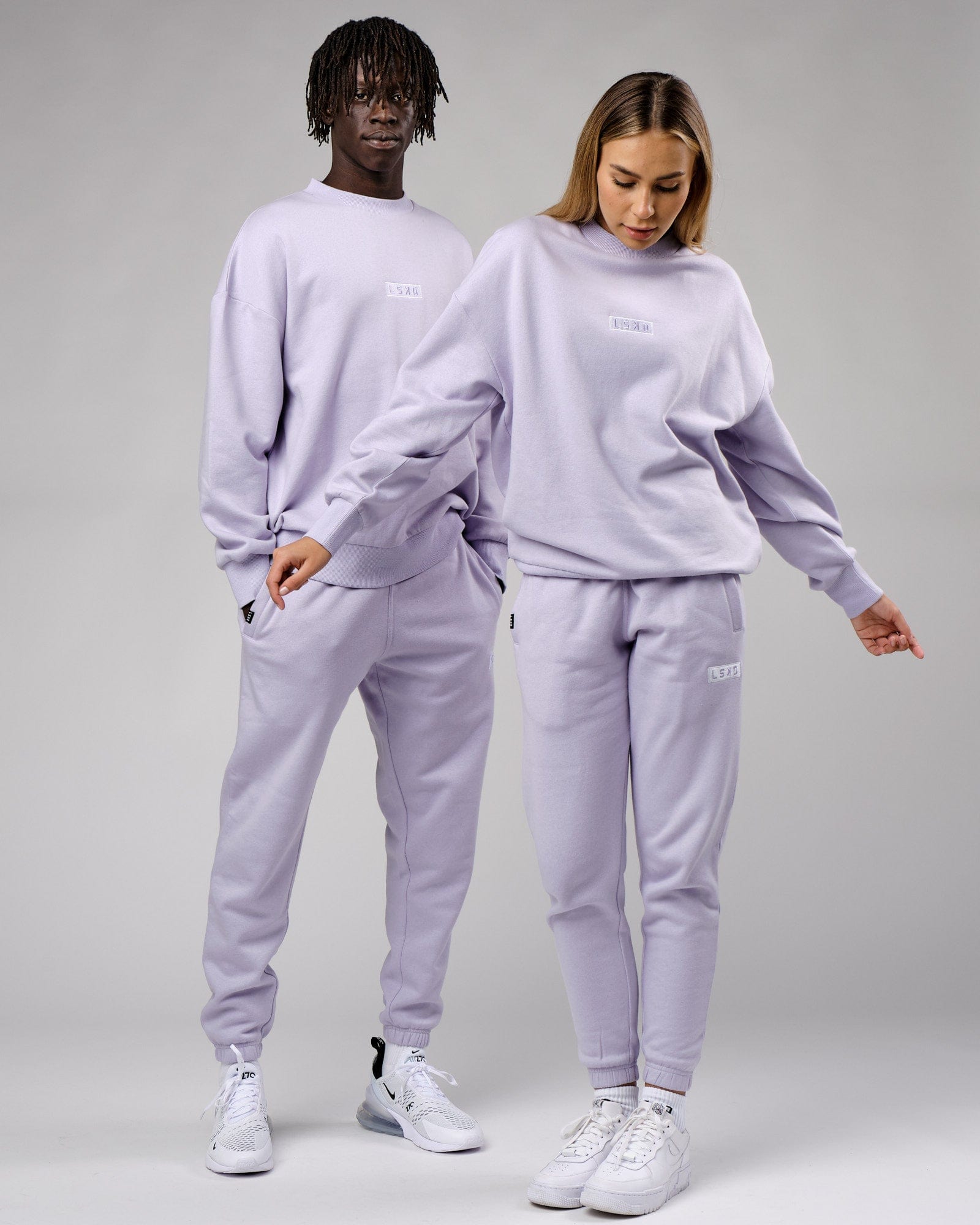 Model wearing Unisex Cornerstone Track Pant Oversize - Cosmic Sky