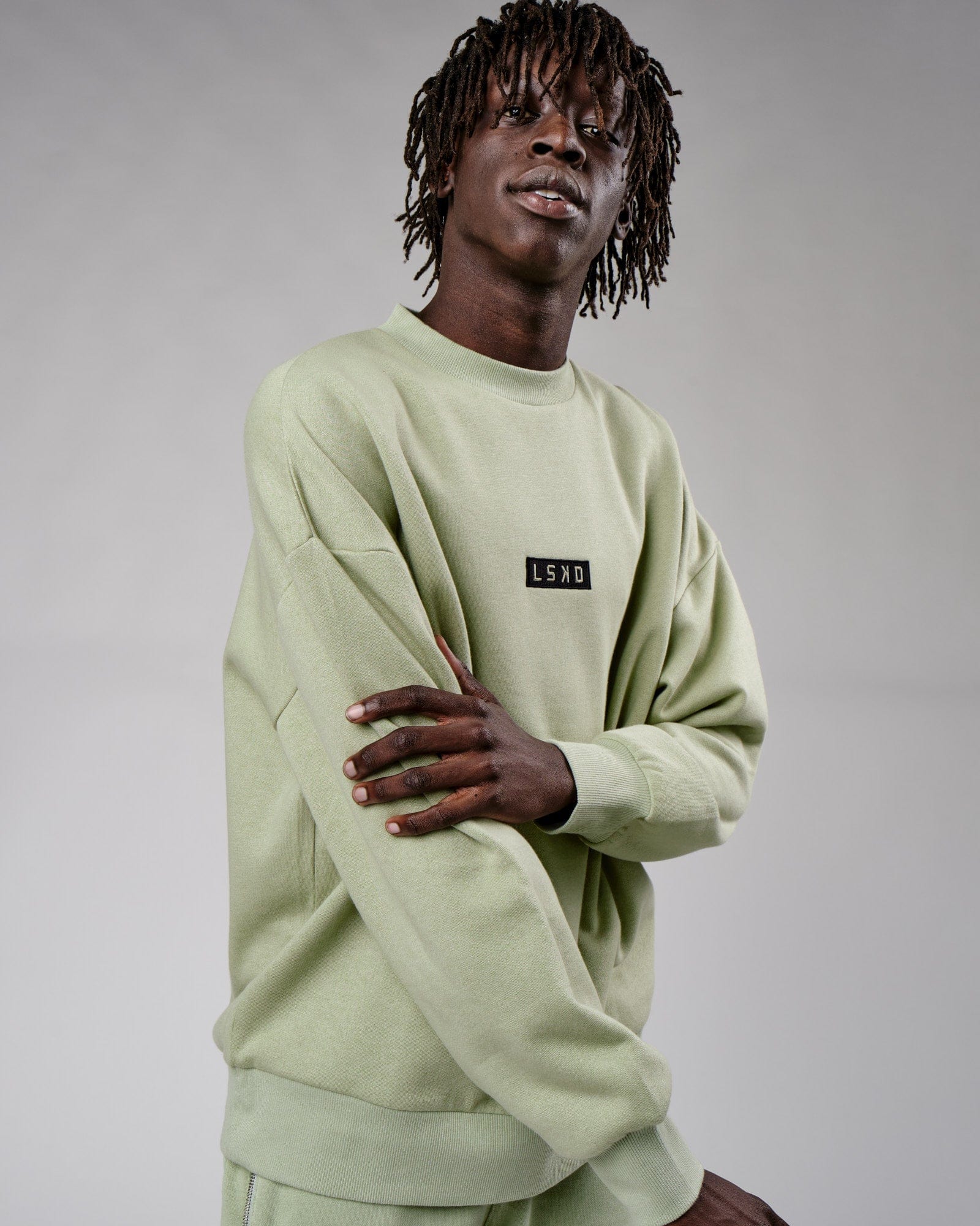 Model wearing Cornerstone Sweater Oversize - Desert Sage