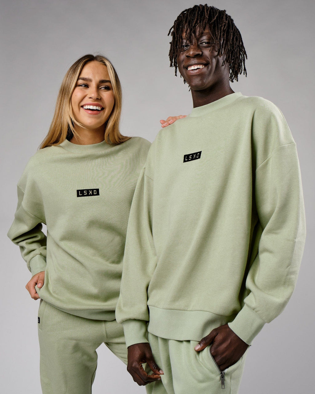 Model wearing Unisex Cornerstone Sweater Oversize - Desert Sage