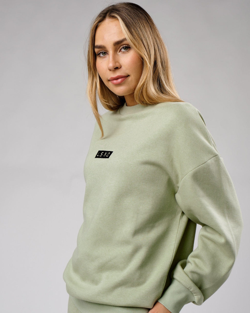 Model wearing Unisex Cornerstone Sweater Oversize - Desert Sage