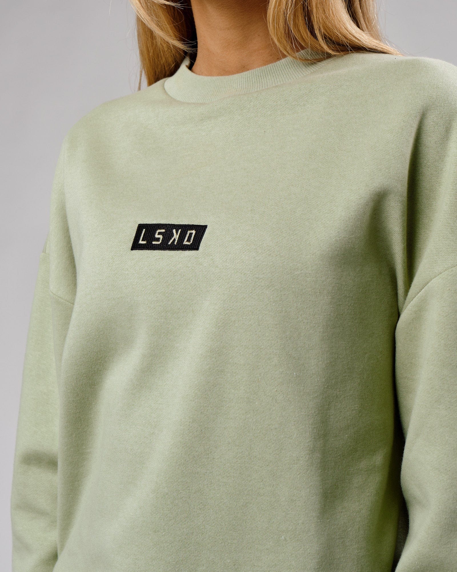 Model wearing Unisex Cornerstone Sweater Oversize - Desert Sage