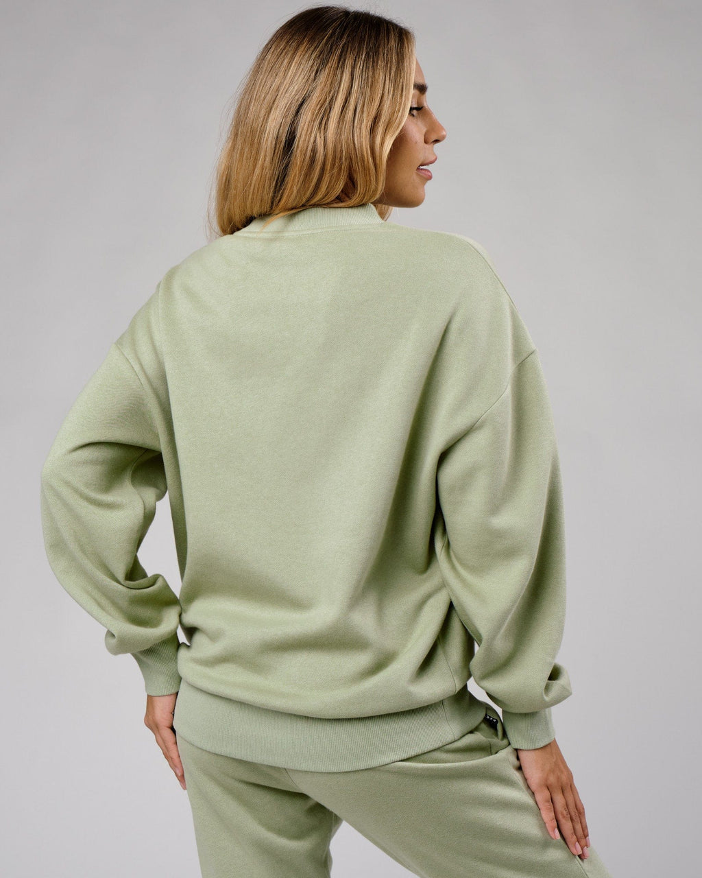 Model wearing Unisex Cornerstone Sweater Oversize - Desert Sage