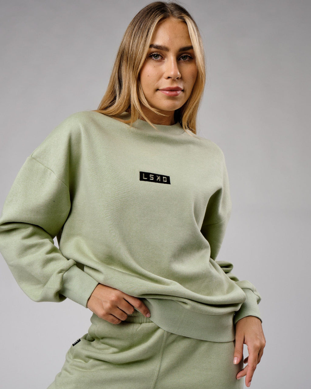 Model wearing Unisex Cornerstone Sweater Oversize - Desert Sage