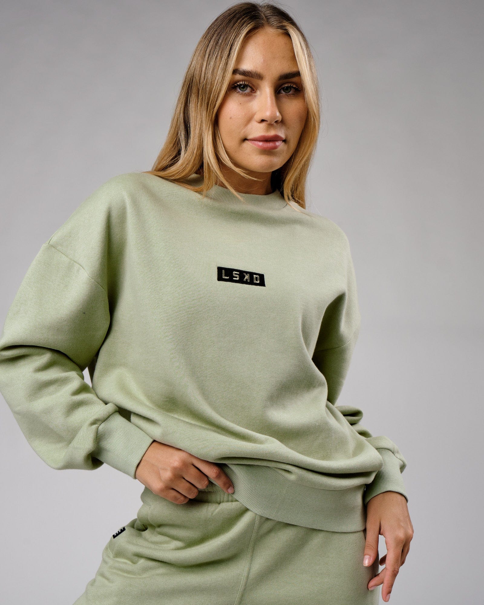Model wearing Unisex Cornerstone Sweater Oversize - Desert Sage