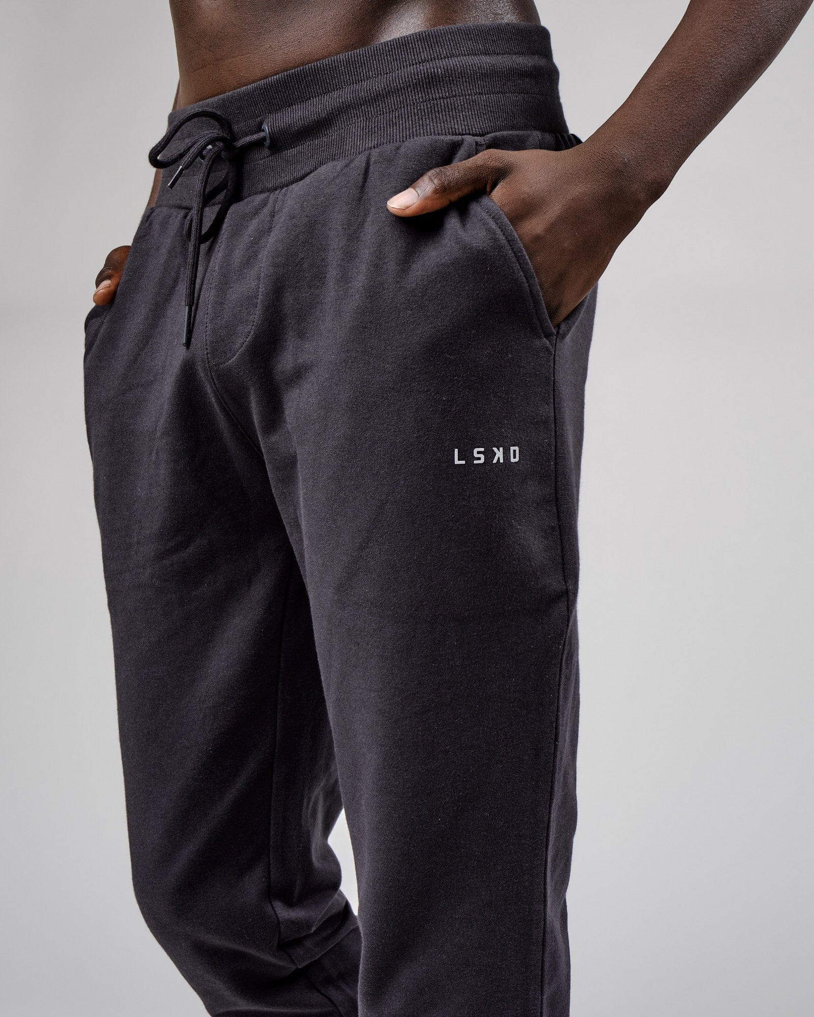 Model wearing Base Track Pant - Phantom