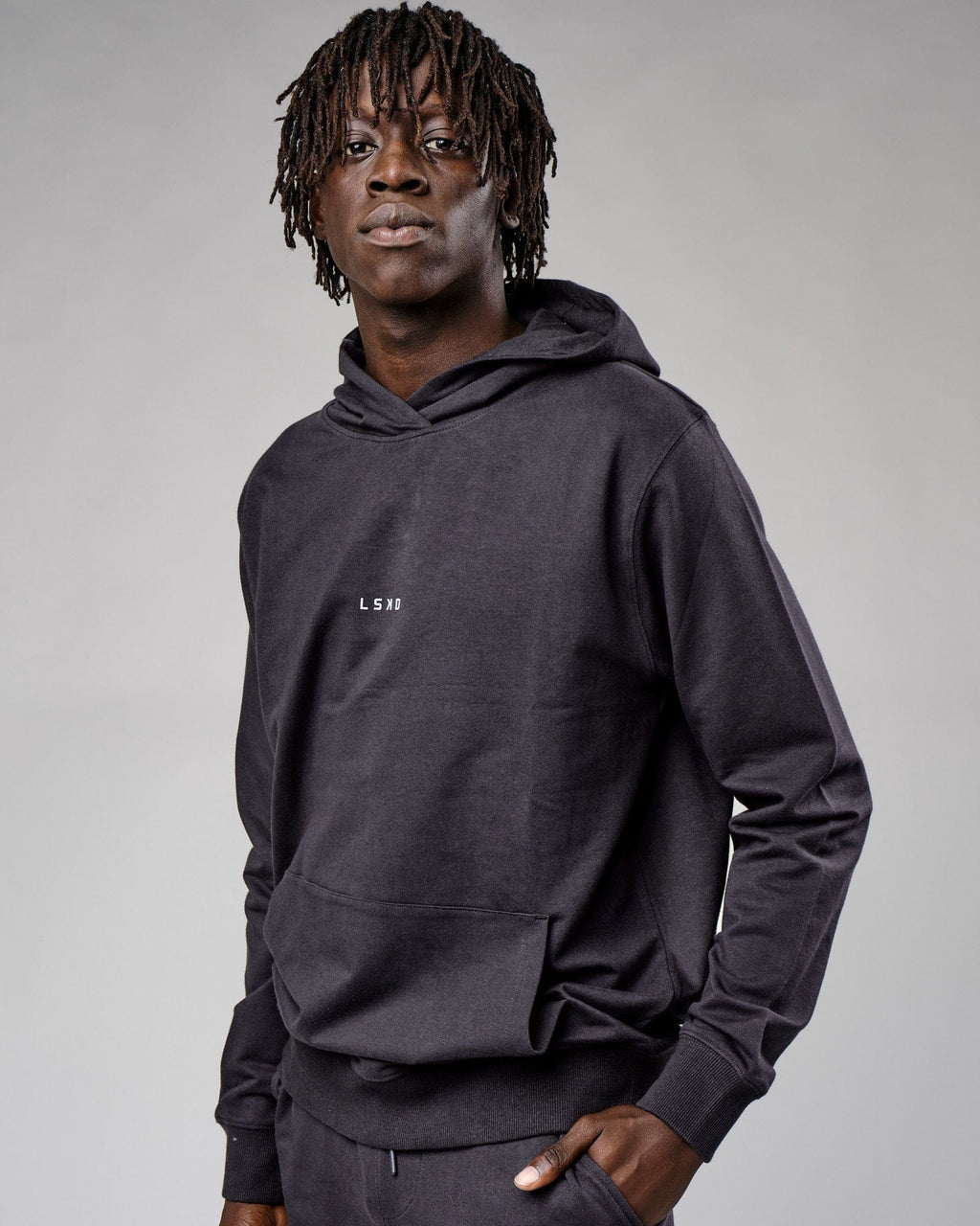 Model wearing Base Hoodie - Phantom