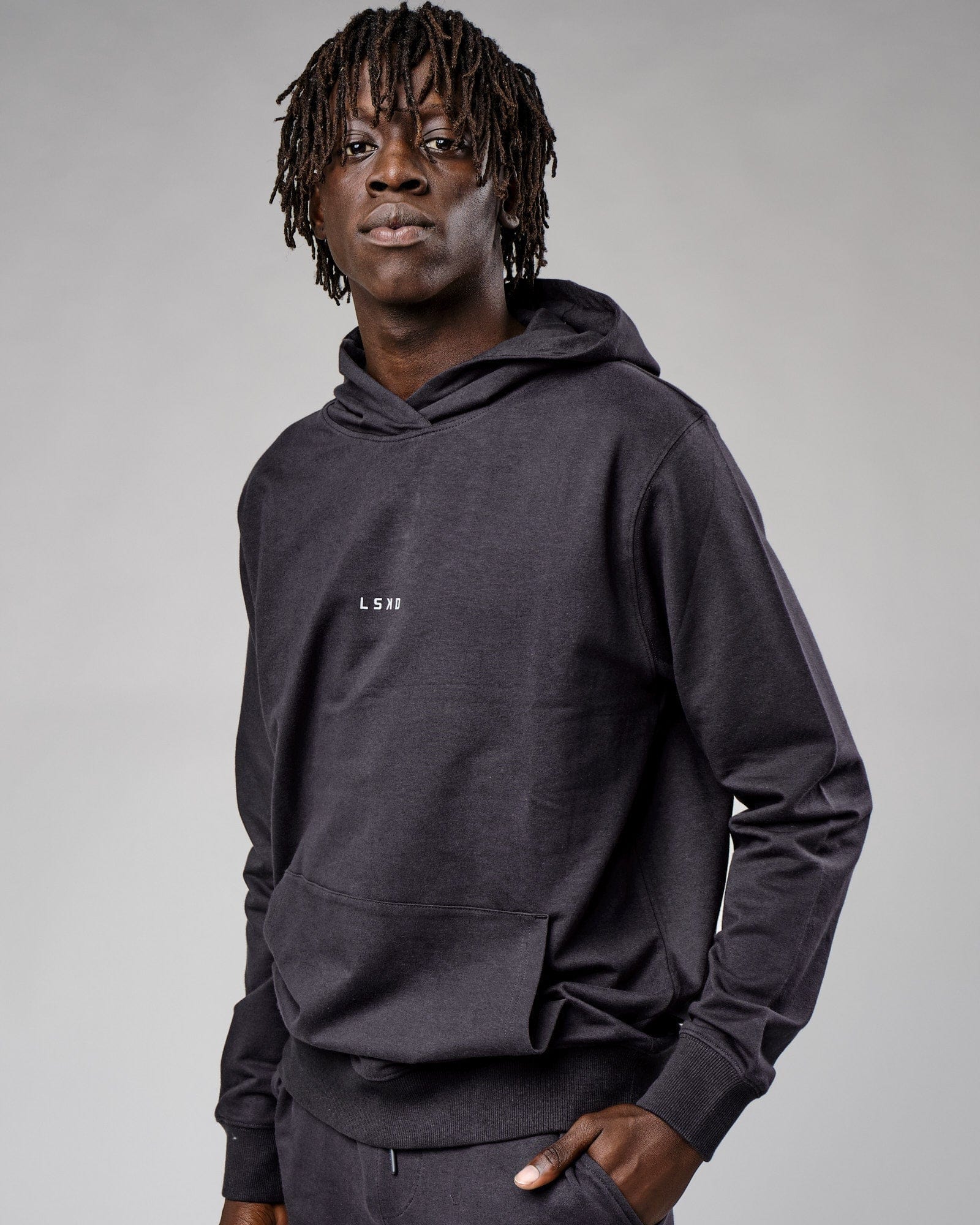 Model wearing Base Hoodie - Phantom