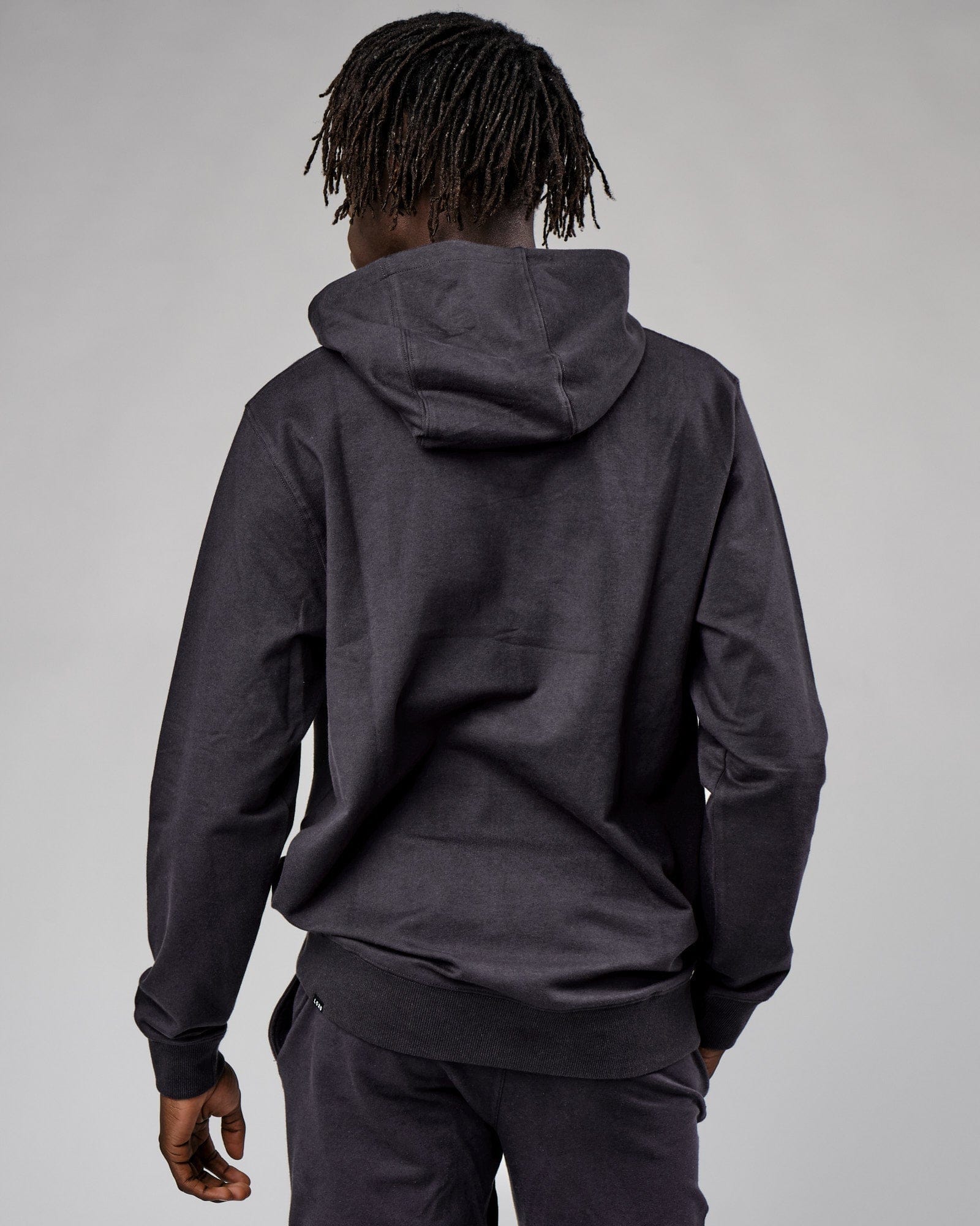Model wearing Base Hoodie - Phantom