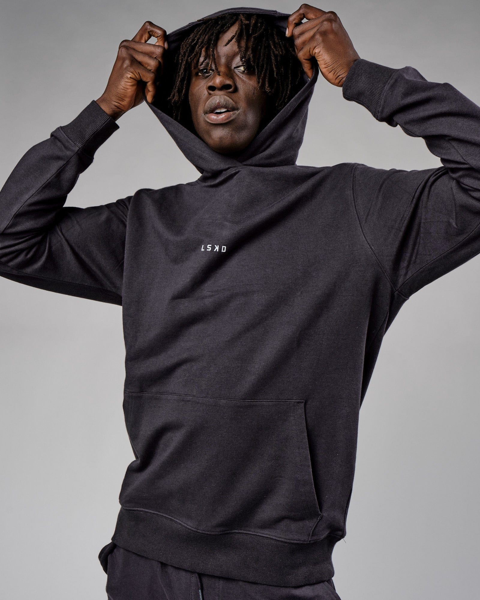 Model wearing Base Hoodie - Phantom