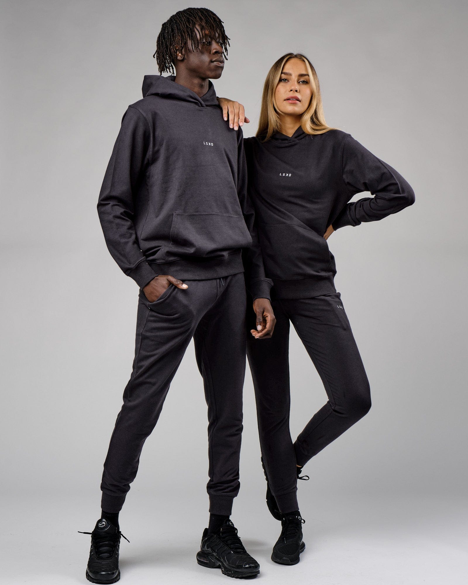 Model wearing Unisex Base Hoodie - Phantom