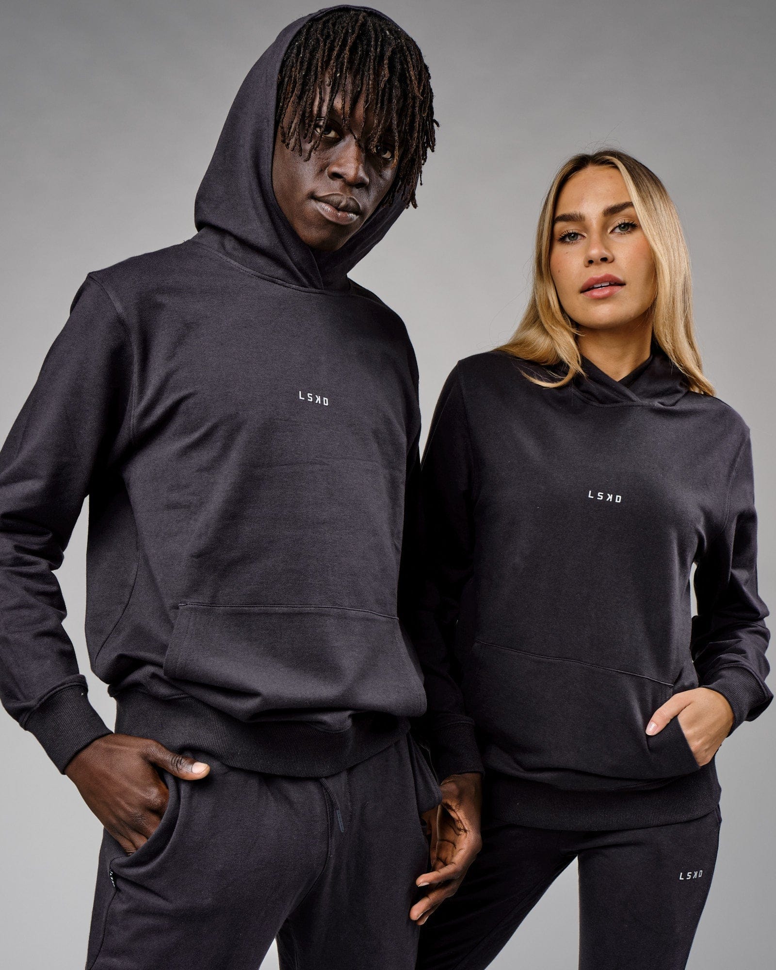 Model wearing Unisex Base Hoodie - Phantom