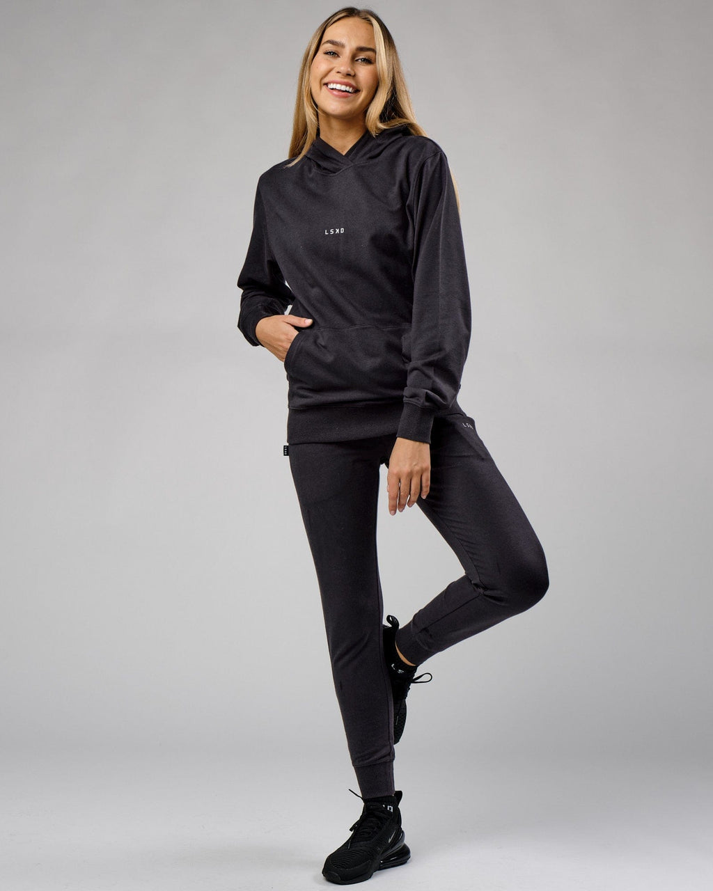 Model wearing Unisex Base Hoodie - Phantom