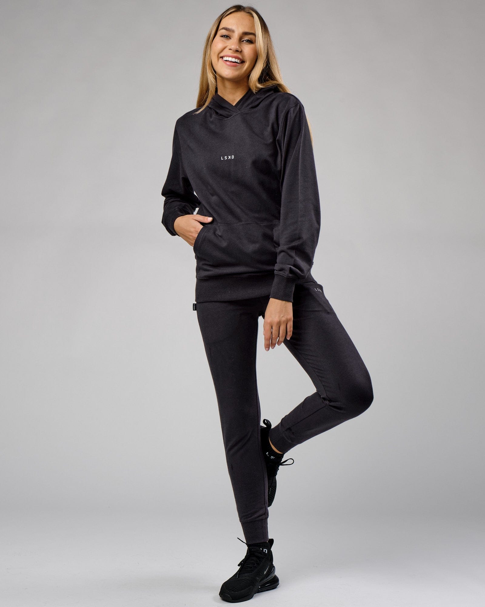 Model wearing Unisex Base Hoodie - Phantom