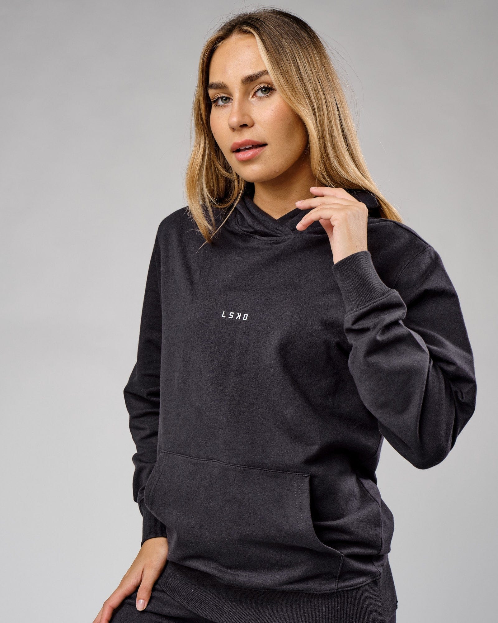 Model wearing Unisex Base Hoodie - Phantom