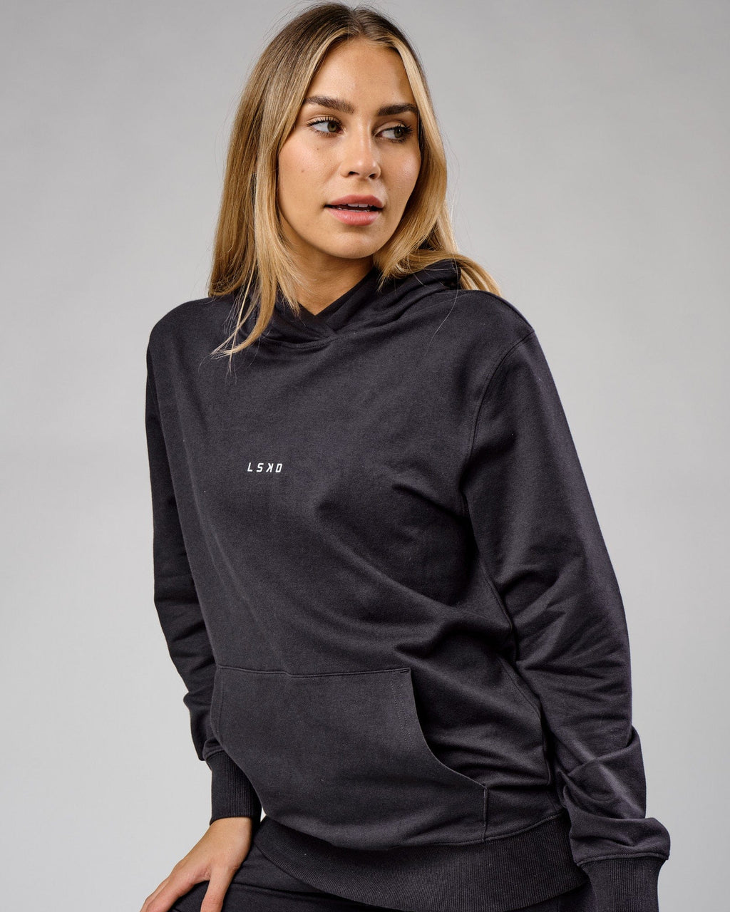 Model wearing Unisex Base Hoodie - Phantom