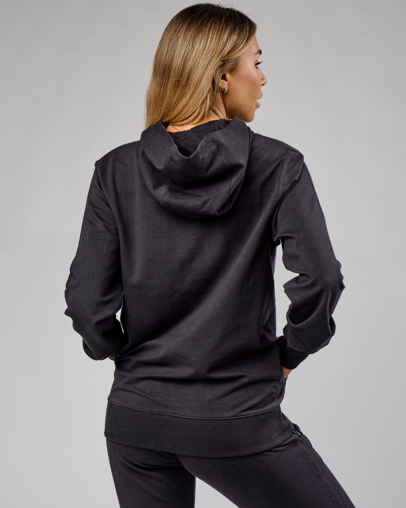 Model wearing Unisex Base Hoodie - Phantom