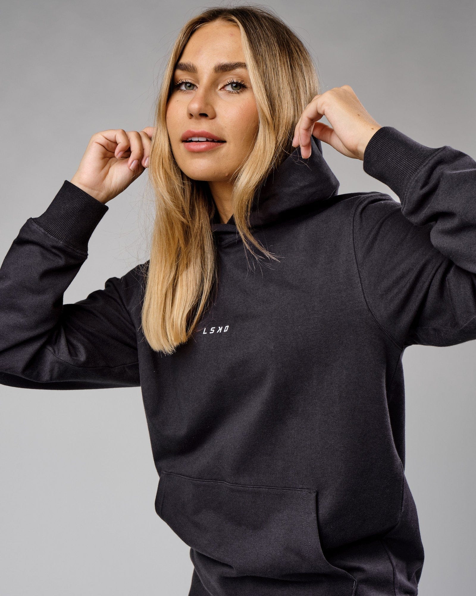 Model wearing Unisex Base Hoodie - Phantom