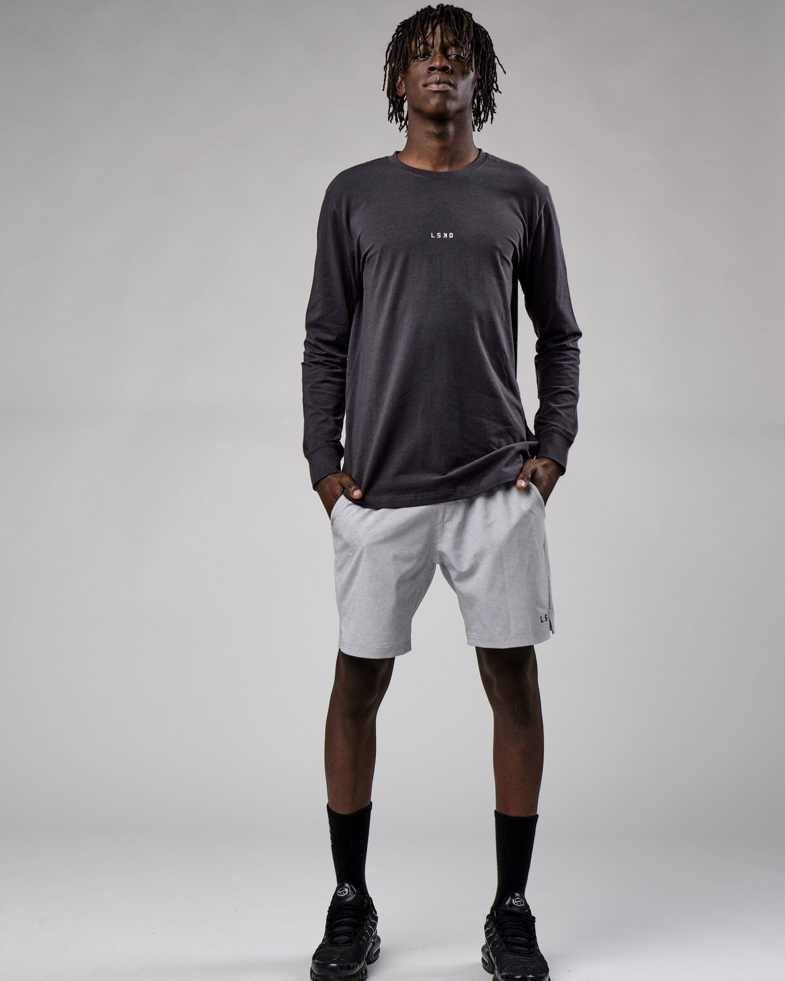 Model wearing Base LS Tee - Phantom