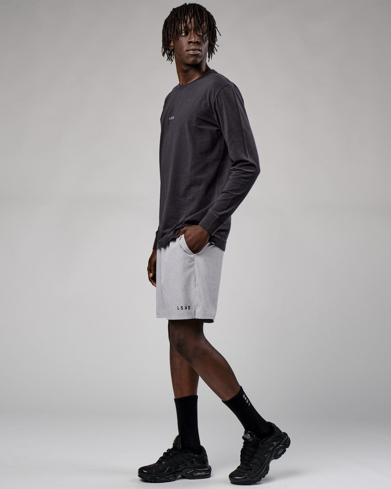 Model wearing Base LS Tee - Phantom