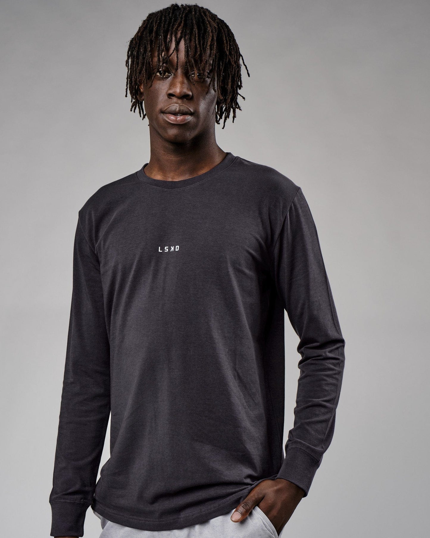 Model wearing Base LS Tee - Phantom