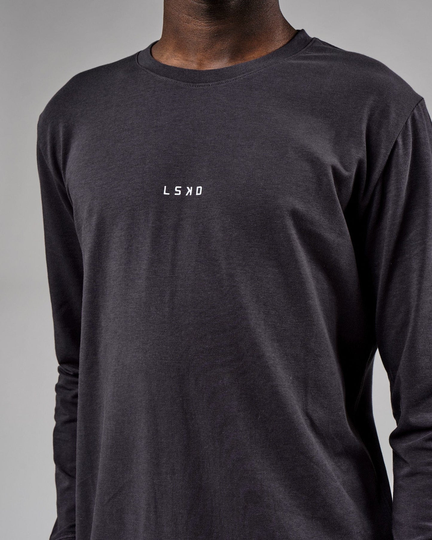 Model wearing Base LS Tee - Phantom