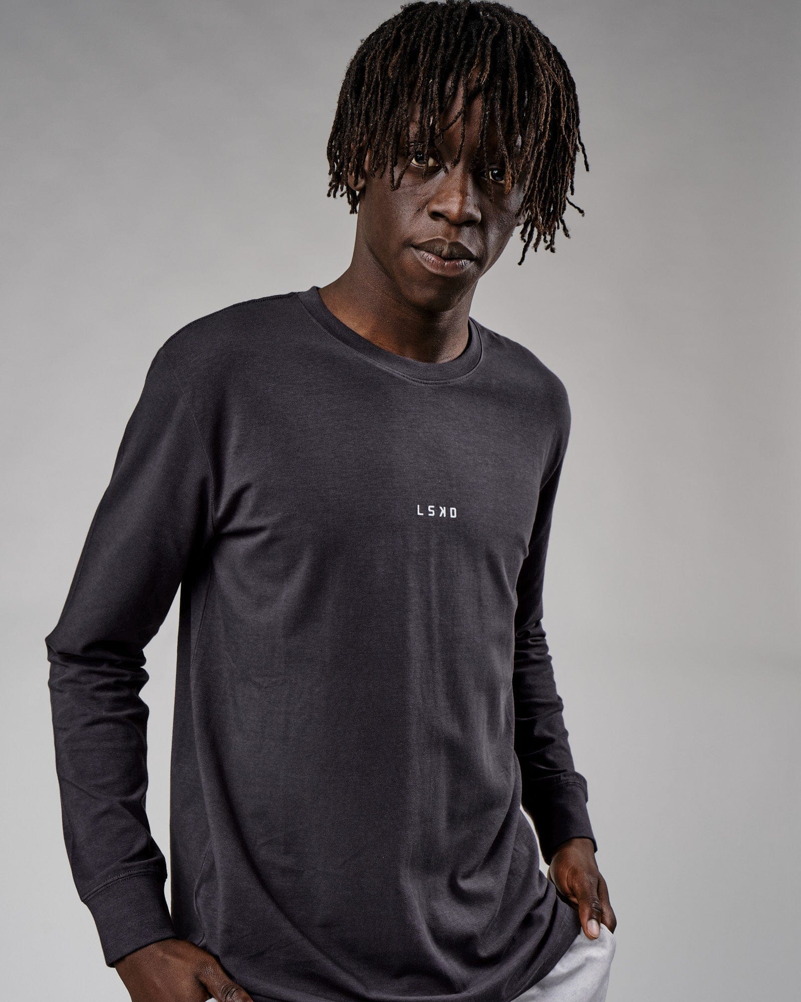 Model wearing Base LS Tee - Phantom