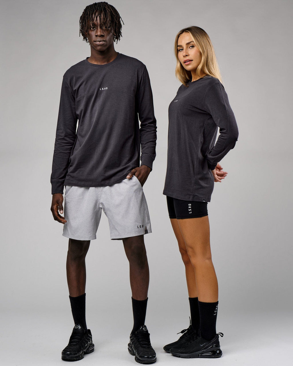 Model wearing Unisex Base LS Tee - Phantom