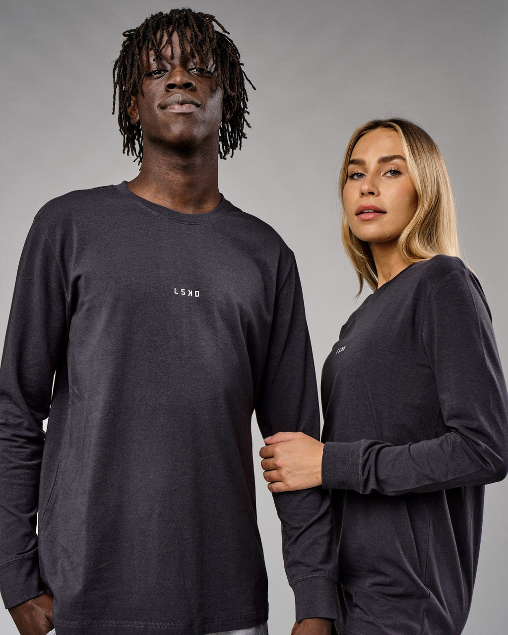 Model wearing Unisex Base LS Tee - Phantom