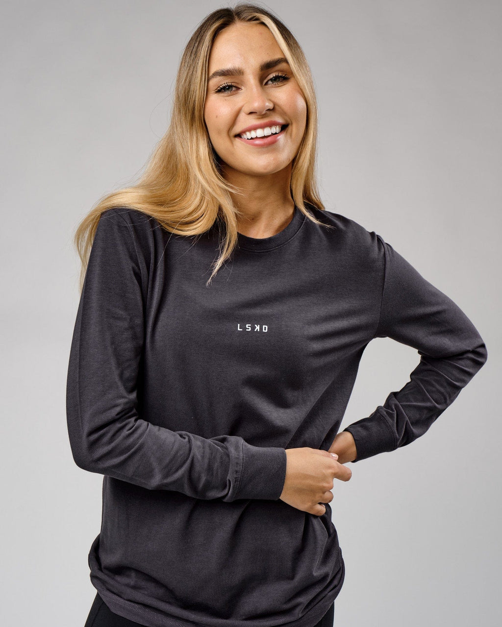 Model wearing Unisex Base LS Tee - Phantom