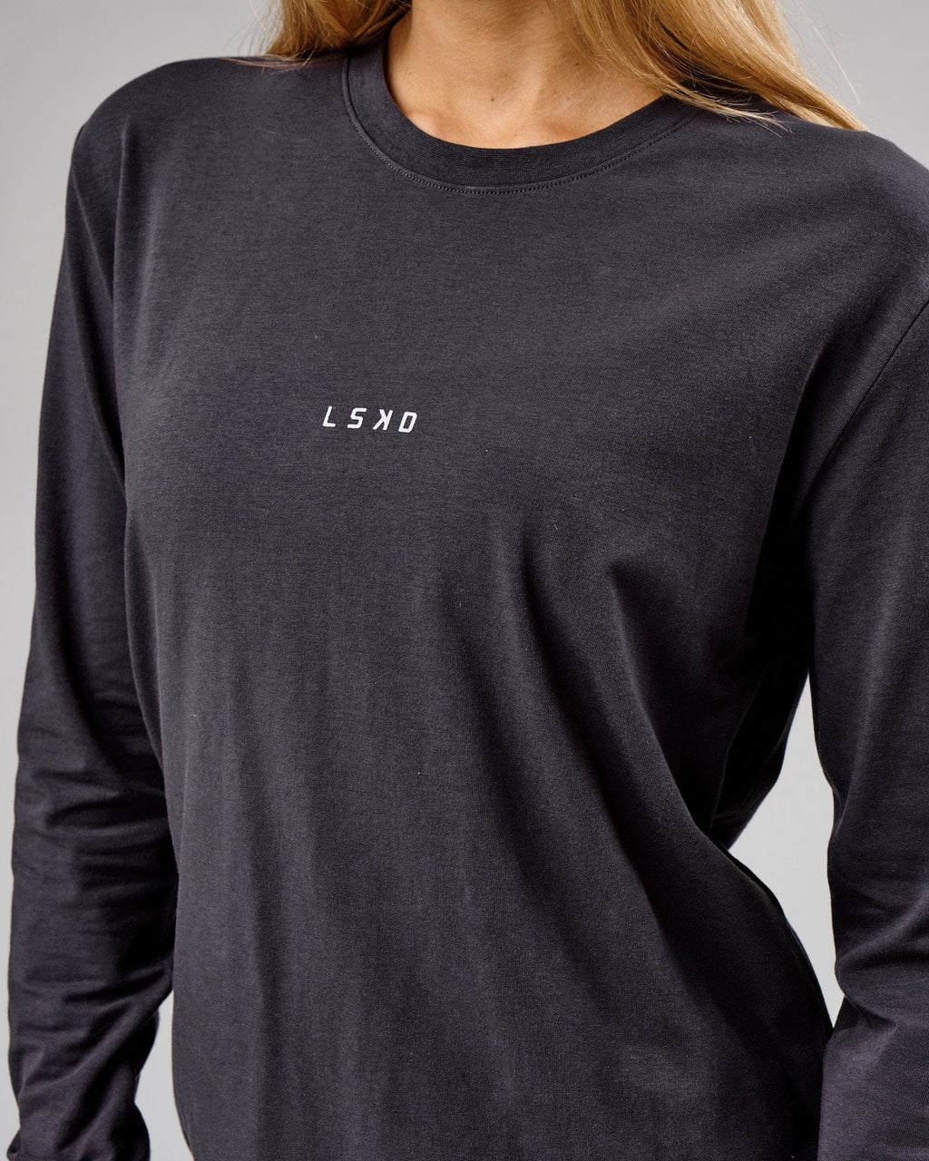 Model wearing Unisex Base LS Tee - Phantom