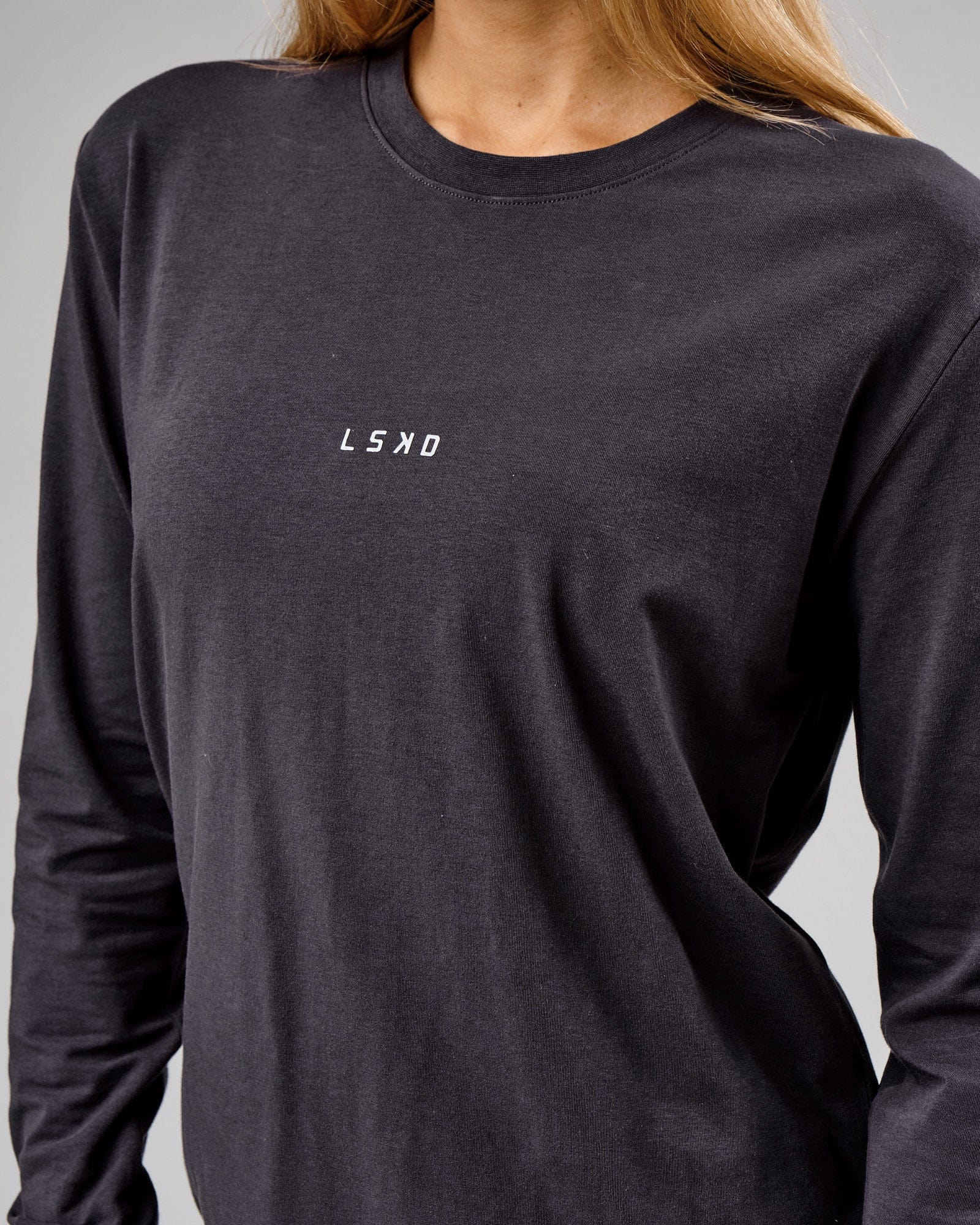 Model wearing Unisex Base LS Tee - Phantom