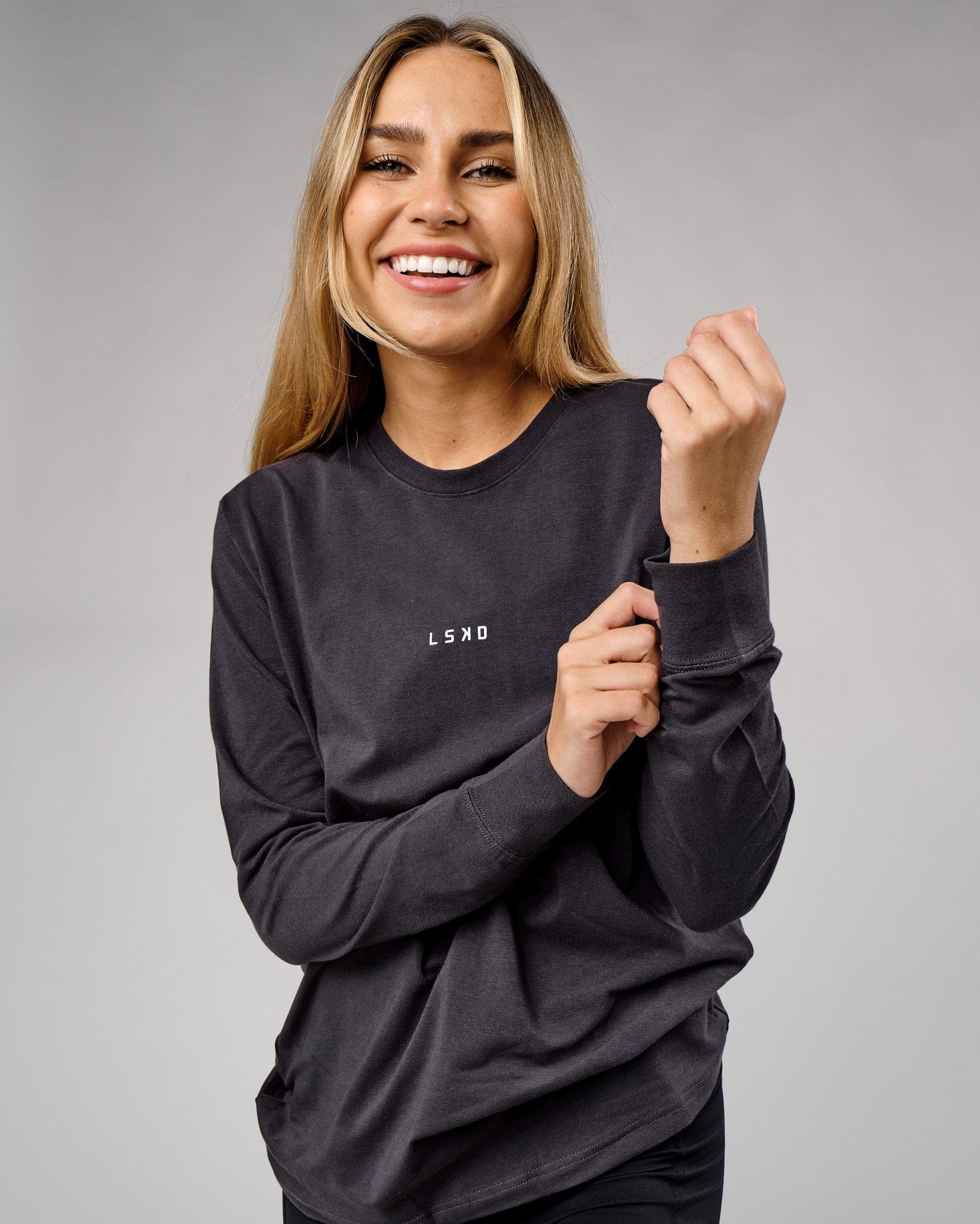 Model wearing Unisex Base LS Tee - Phantom