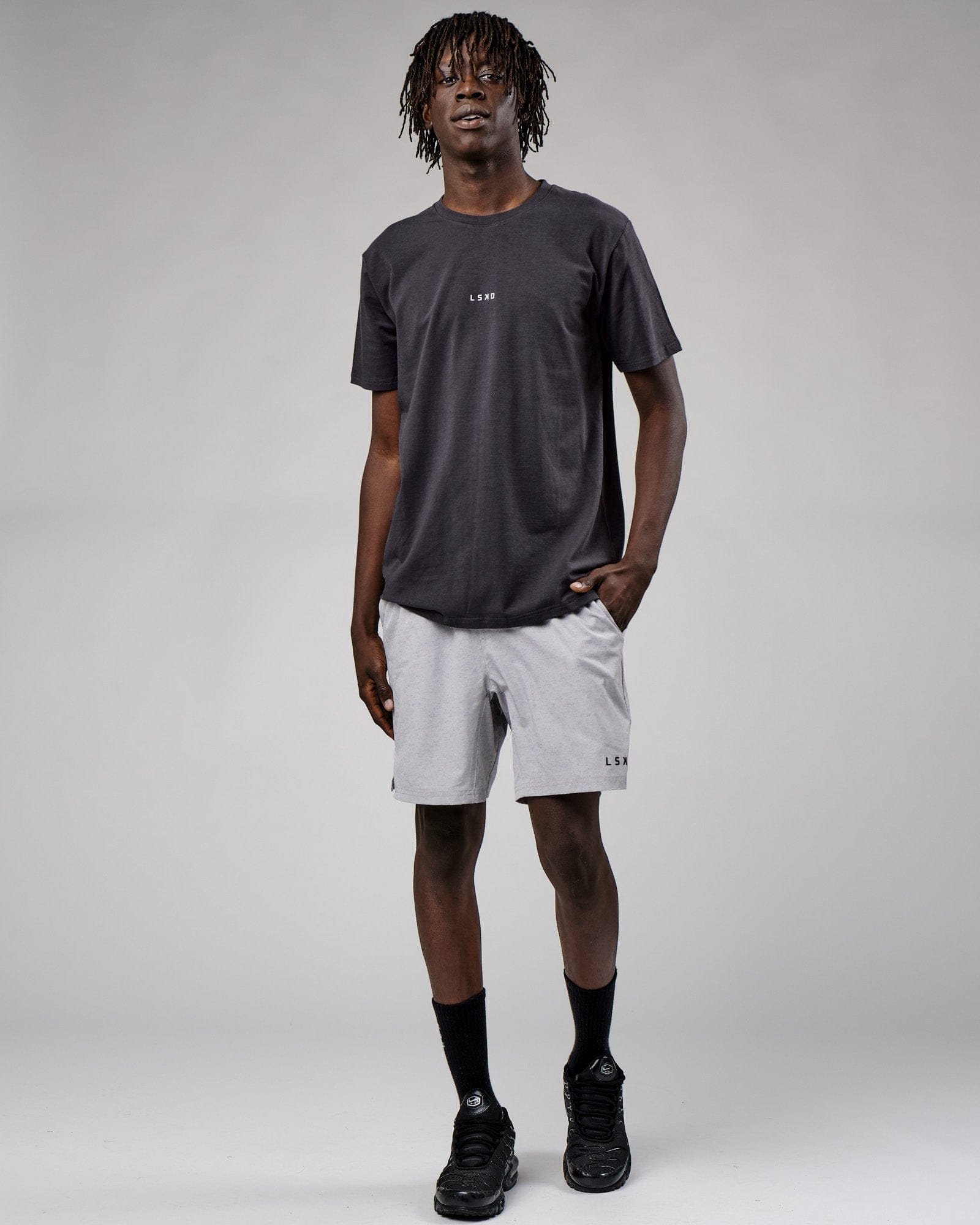 Model wearing Base Tee - Phantom