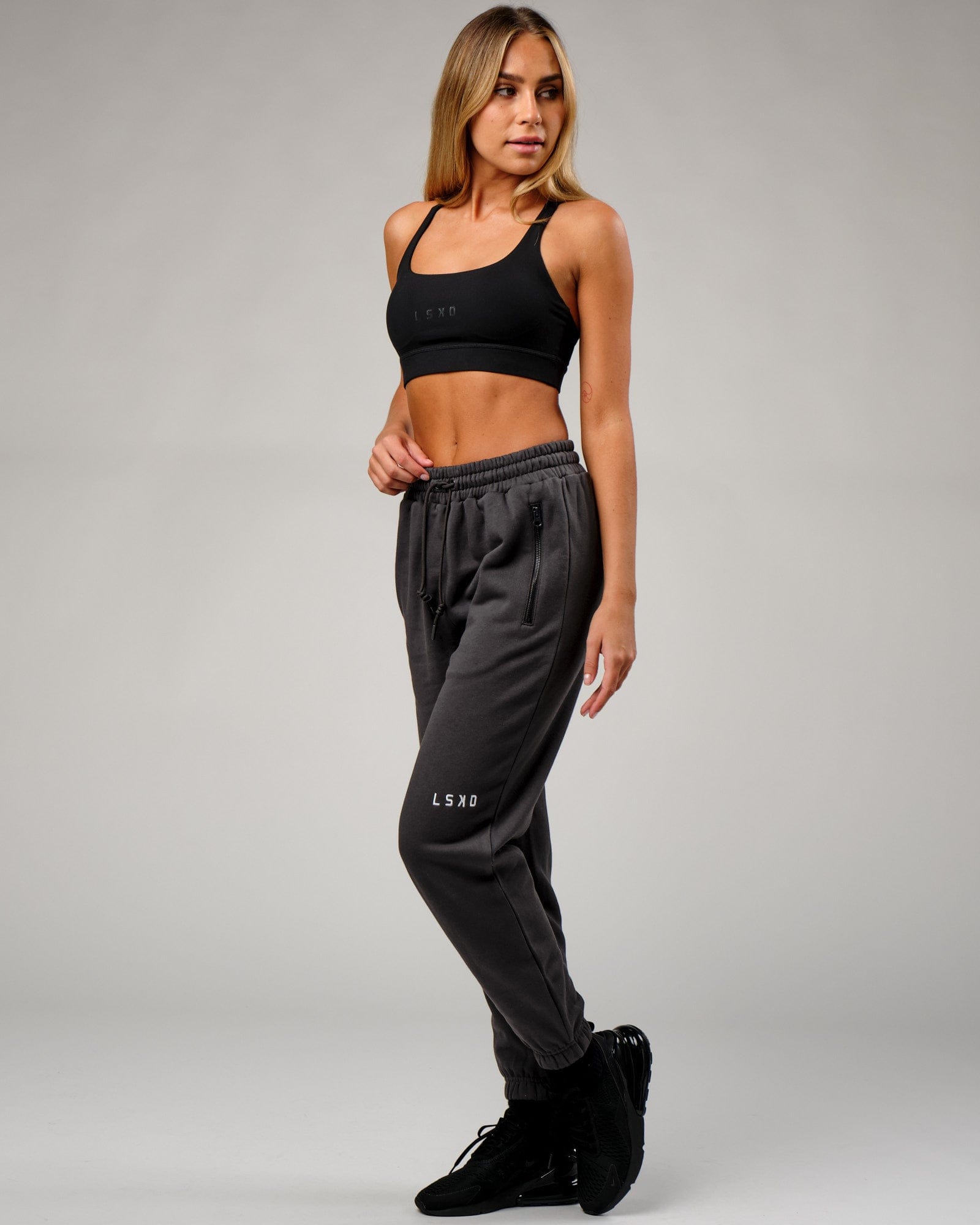 Model wearing Becca Track Pant - Phantom