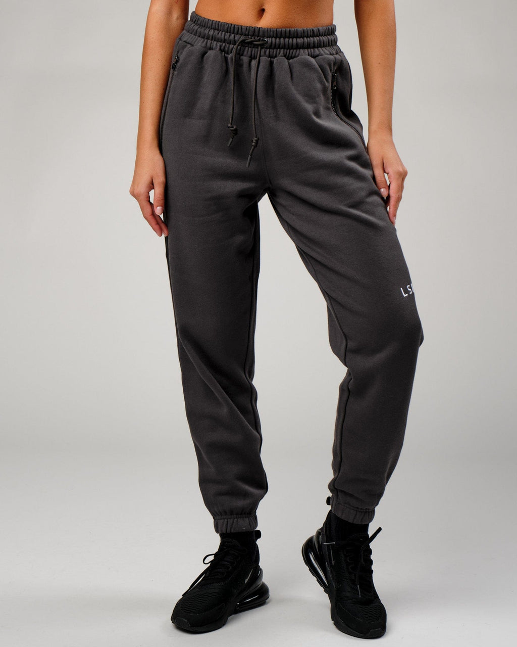 Model wearing Becca Track Pant - Phantom